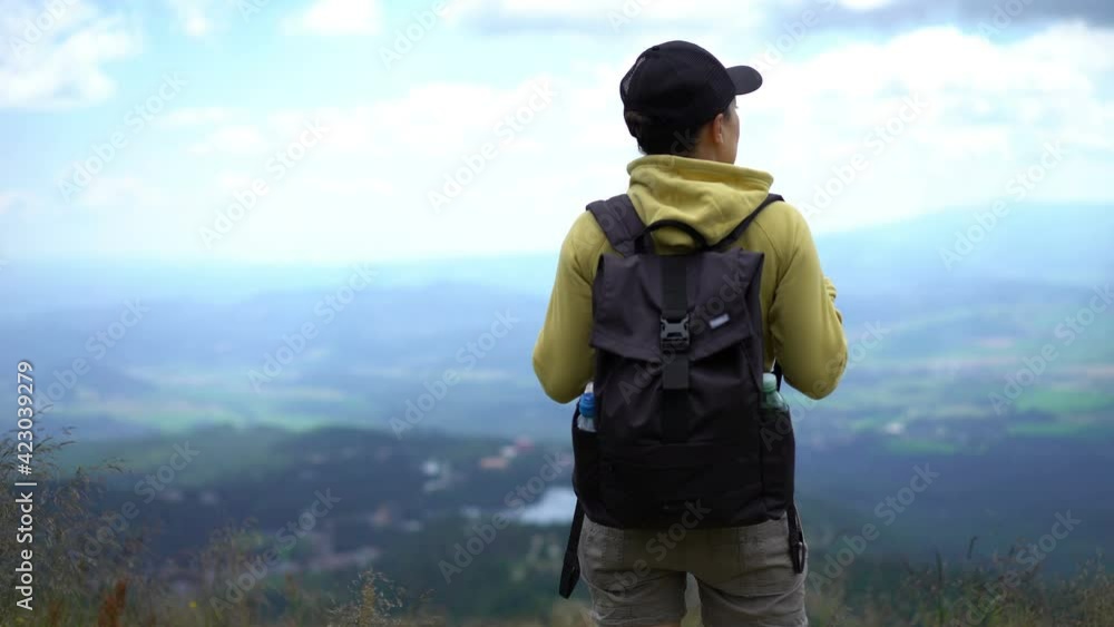 Young female tourist standing and enjoying beautiful view in the mountains, Slovakia, High Tatras
Young female tourist standing and enjoying beautiful view in the mountains, Slovakia, High Tatras