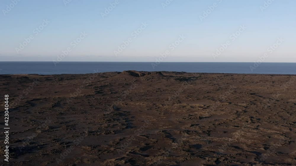 Aerial at Reykjanes volcanic coast of Iceland on clear day with view of ocean Aerial at Reykjanes volcanic coast of Iceland on clear day with view of ocean