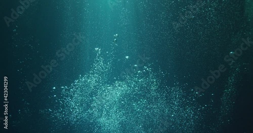 Sunbeams and bubbles underwater