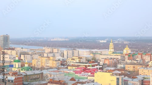 Perm, Russia - November 4, 2020: view of the bridge over the Kama river and the buildings of the city. Art galleries and buildings in the historic center during the winter season. photo