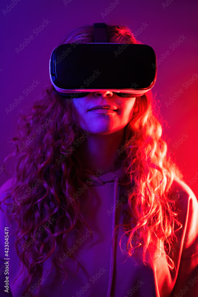 Young girl in virtual reality glasses at home Young girl in virtual reality glasses at home