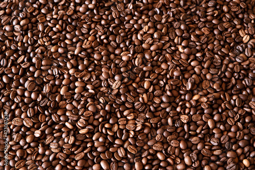 Background from a variety of roasted coffee beans.The texture of coffee beans.