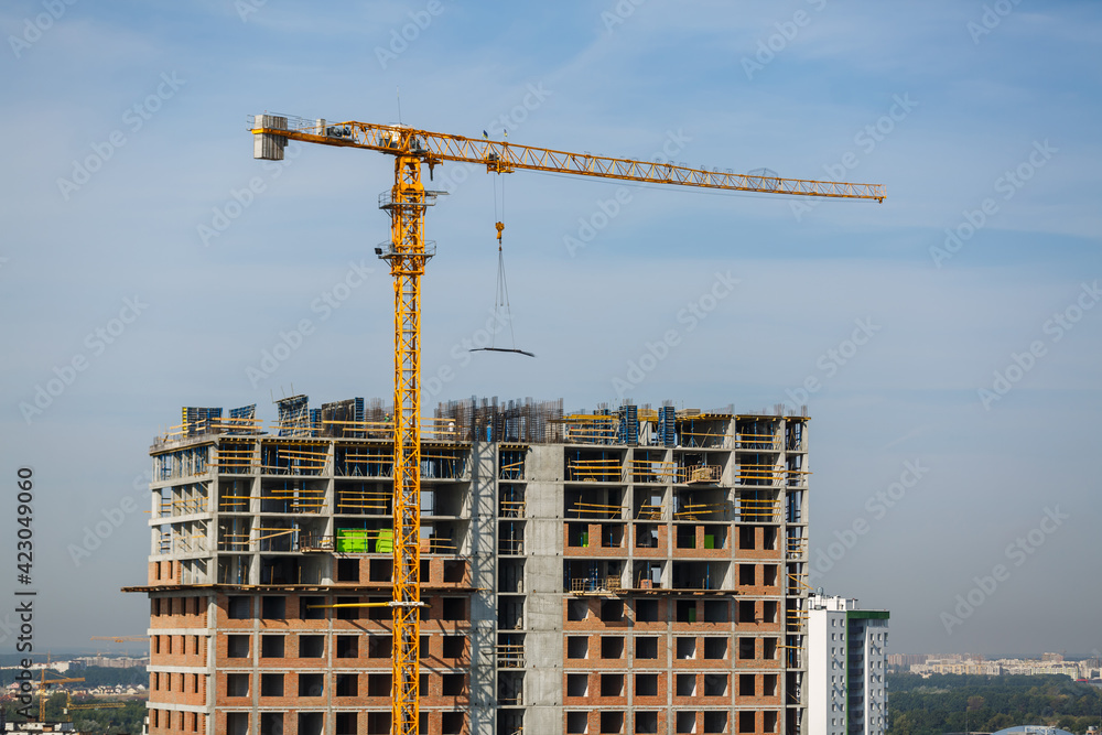 Construction site with concrete and steel and crane lifting equipment Construction site with concrete and steel and crane lifting equipment