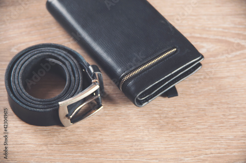 belt on wallet on the wooden table background