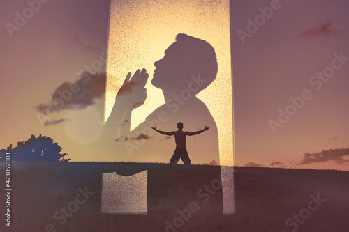 Bilde på lerret Young man worshiping and praying to god in nature setting