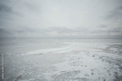 Empty snow land. Gray sky and ice 