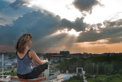 Fototapeta Naklejka Na Ścianę i Meble -  Attractive girl meditating at sunbeam