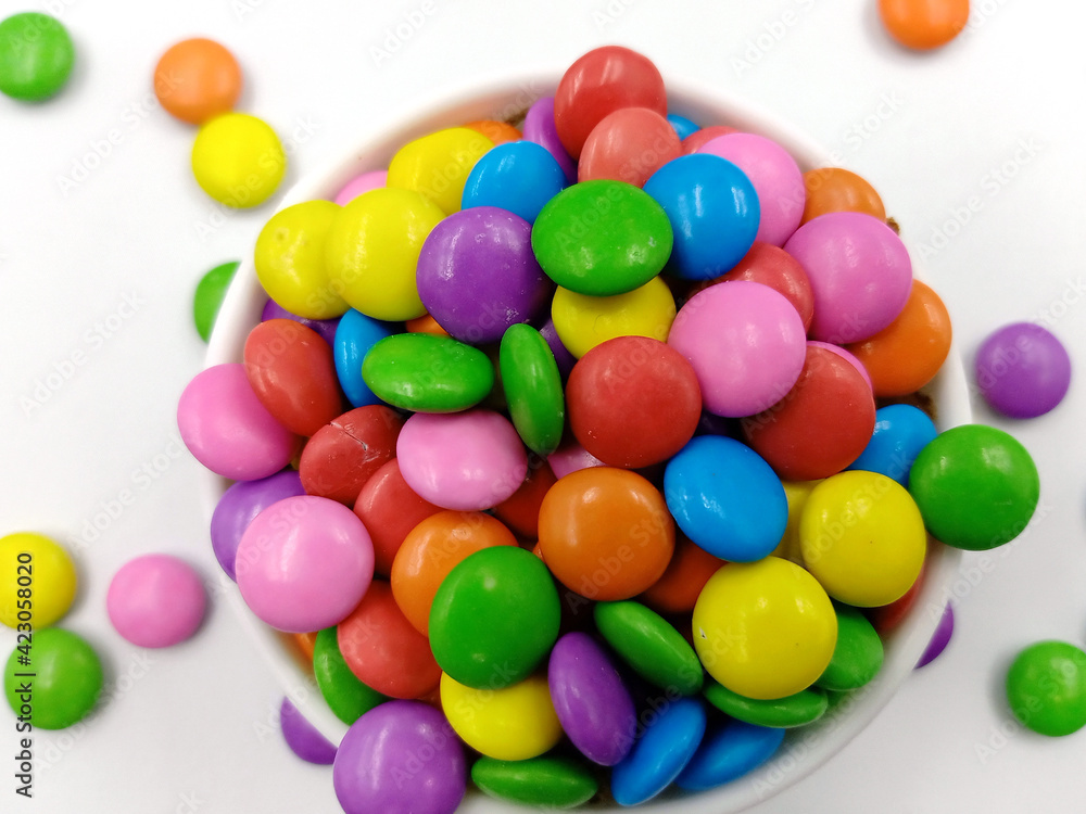 Bright multi colour chocolate gemes on white background Bright multi colour chocolate gemes on white background