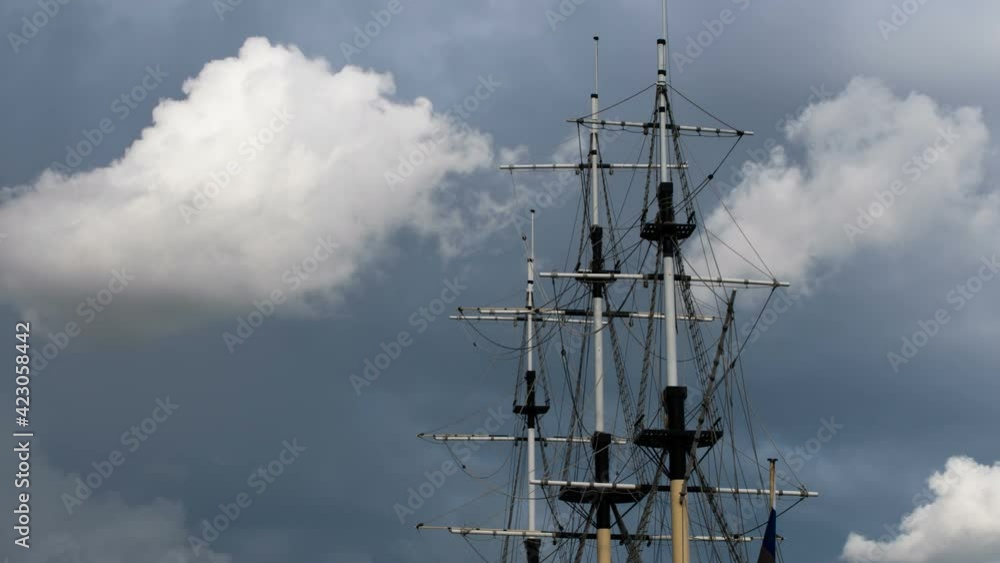 Storm is Approaching. Timelapse. The sky darkens and the clouds slowly condense over the masts of an old sailboat Storm is Approaching. Timelapse. The sky darkens and the clouds slowly condense over the masts of an old sailboat