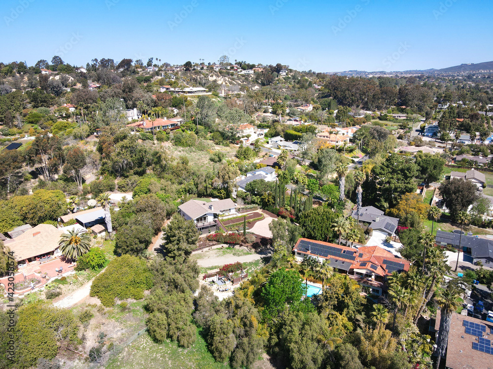 Fototapeta premium Aerial view of Rancho Santa Fe neighborhood with big mansions with pool in San Diego, California, USA. Aerial view of residential modern luxury house.