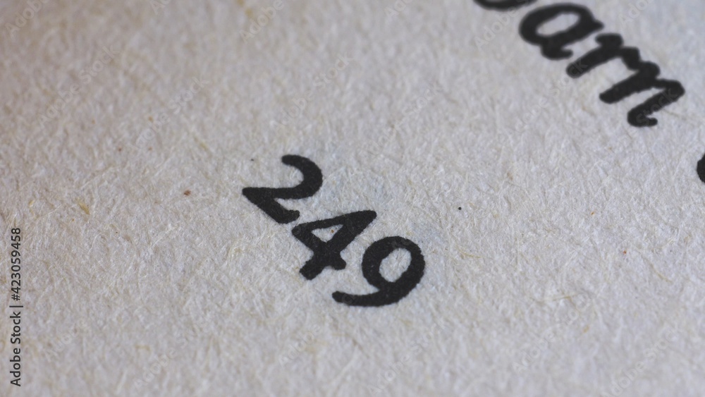 Flicking Through Old Book Page Numbers Close-up