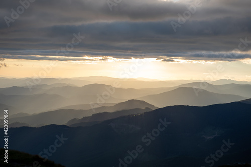 view of sunset above mountains peak
