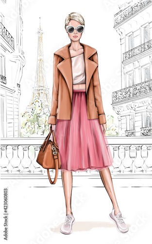 Beautiful young girl in fashion clothes. Stylish woman with Paris background. Fashion girl holding bag. Fashion illustration.