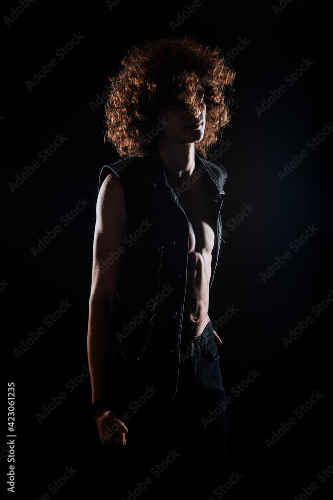 Rock guy with curly afro hair posing Rock guy with curly afro hair posing