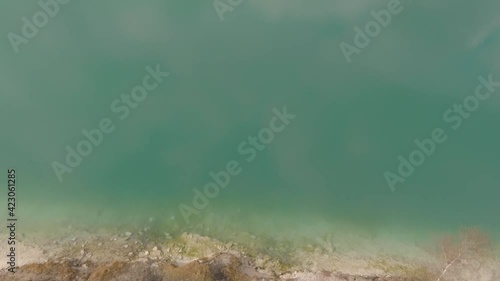 Aerial footage of Karlstrup limestone quarry, outside Copenhagen, Denmark. Formed millions of  years ago during Cretaceous Period. In middle of the quarry there is lake with crystal clear blue water