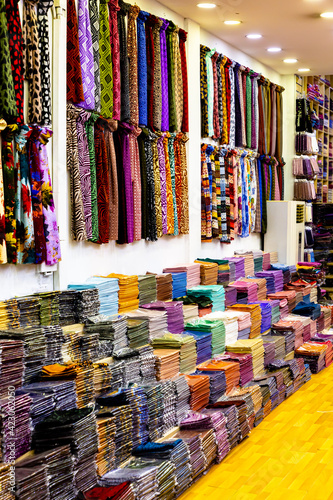Arab store selling a variety of fabrics, Fabric in rolls