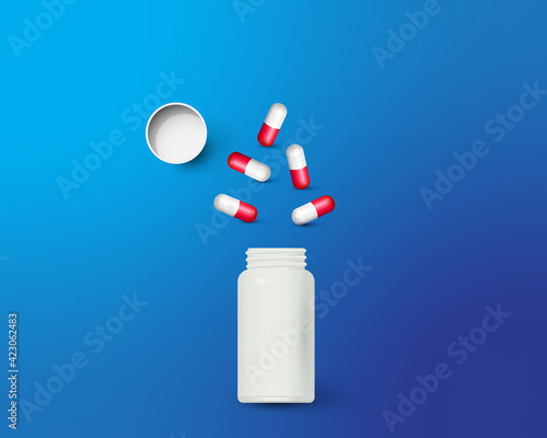 Bottle and scattered pills on color background.