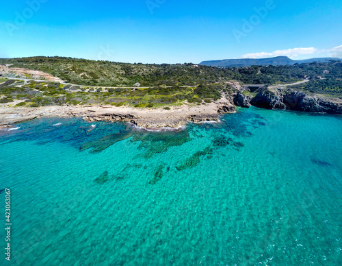 Turquoise water by Alghero shoreline in springtime