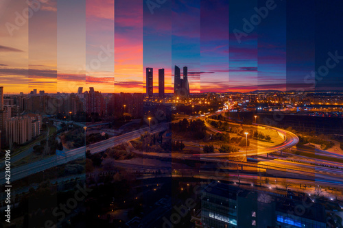 Contemporary skyscraper and multistory house exteriors against roadway and shiny light posts in Madrid at sunset
