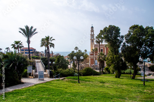 Tel Aviv-Jaffo, Israel - March 15, 2021: View of the St. Peter's Church, bell tower of the Saint Peter Church and Bridge of desires in Old Jaffa in Tel Aviv Yaffo, Israel