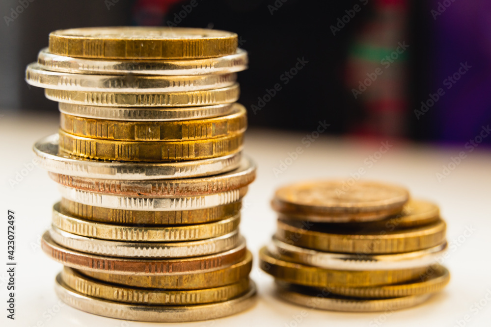 Euro coins stacked on each other in different positions. Euro coins stacked on each other in different positions.