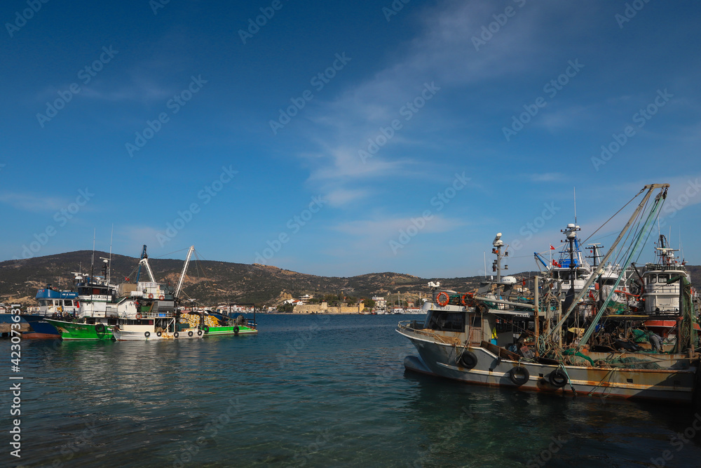 (Eskifoca - Izmir 08. March. 2021) Small boats in the sea at Eskifoca bay.