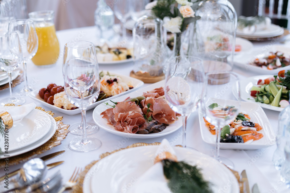 Wedding table with food and drinks, beautiful dishes, luxury catering. Wedding table with food and drinks, beautiful dishes, luxury catering.
