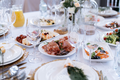 Wedding table with food and drinks  beautiful dishes  luxury catering.