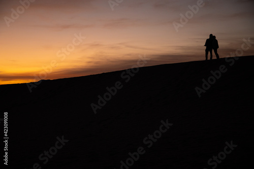 silhouette of a person on the top of mountain © Laurence Leung