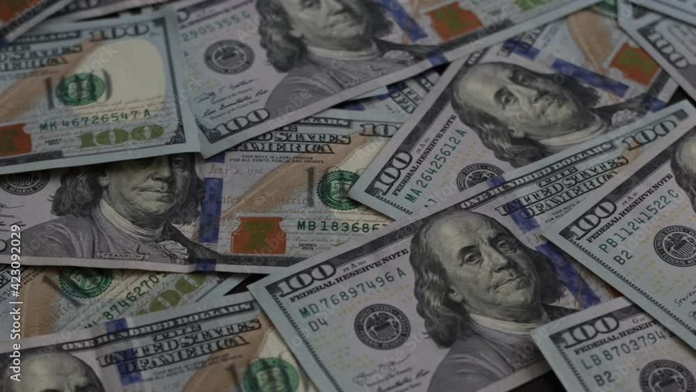 Hands counting US Dollar bills or paying in cash on money background. Concept of investment, success, financial prospects or career advancement. Hands counting US Dollar bills or paying in cash on money background. Concept of investment, success, financial prospects or career advancement.