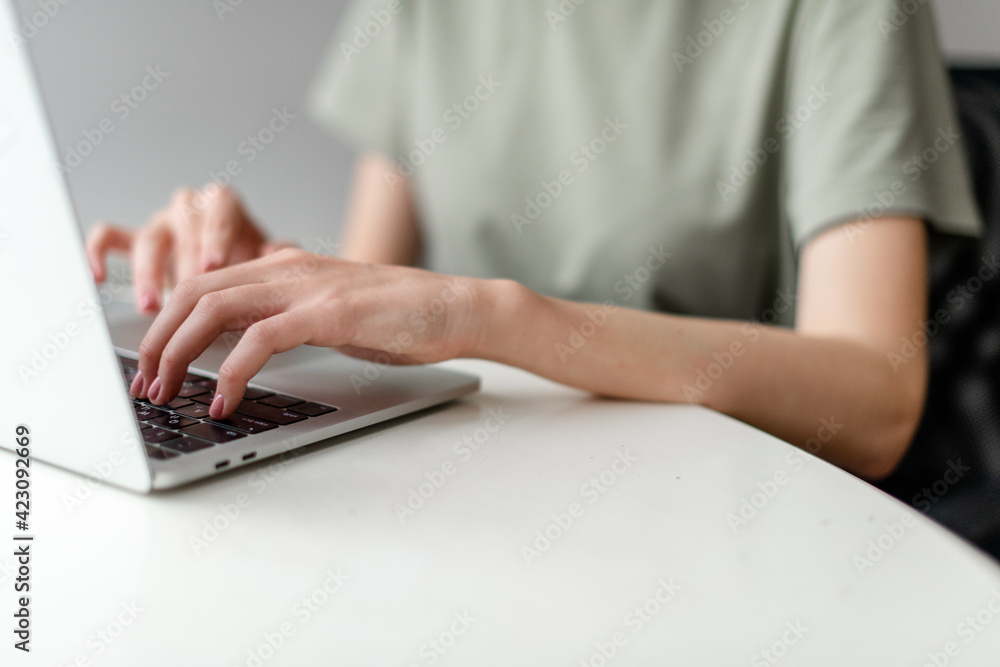 Woman working at home office hand on keyboard close up Woman working at home office hand on keyboard close up