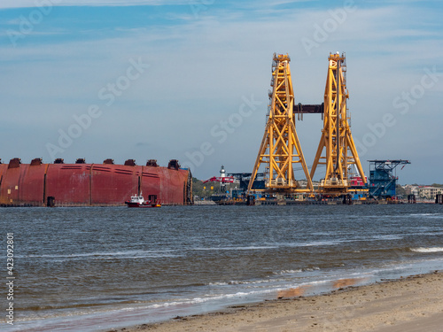 Tablou pe pânză St Simons Island, GA USA - March 23 2021: Disassembly of Golden Ray cargo ship in the St