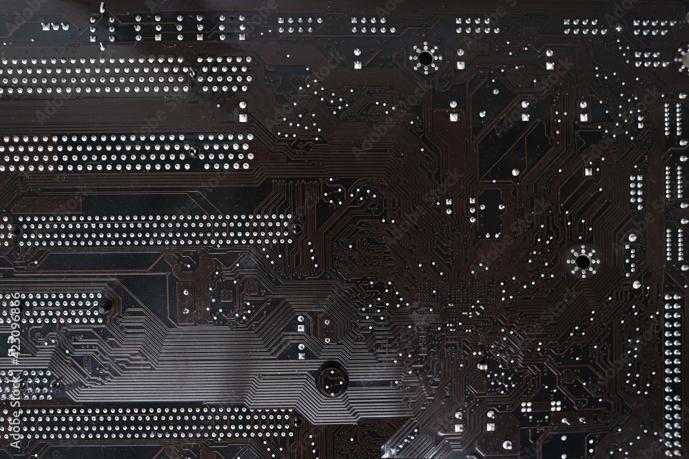 Fototapeta premium brown electronic printed circuit board, PCB with microelectronic components for technology and computer systems, modern technology concept