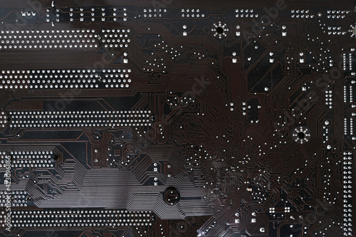 brown electronic printed circuit board, PCB with microelectronic components for technology and computer systems, modern technology concept photo