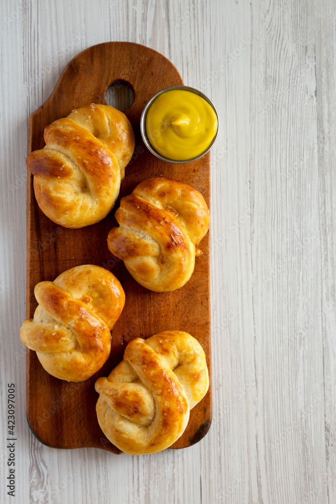 Homemade Basic Soft Pretzels with Mustard, top view. Flat lay, overhead, from above. Space for text.