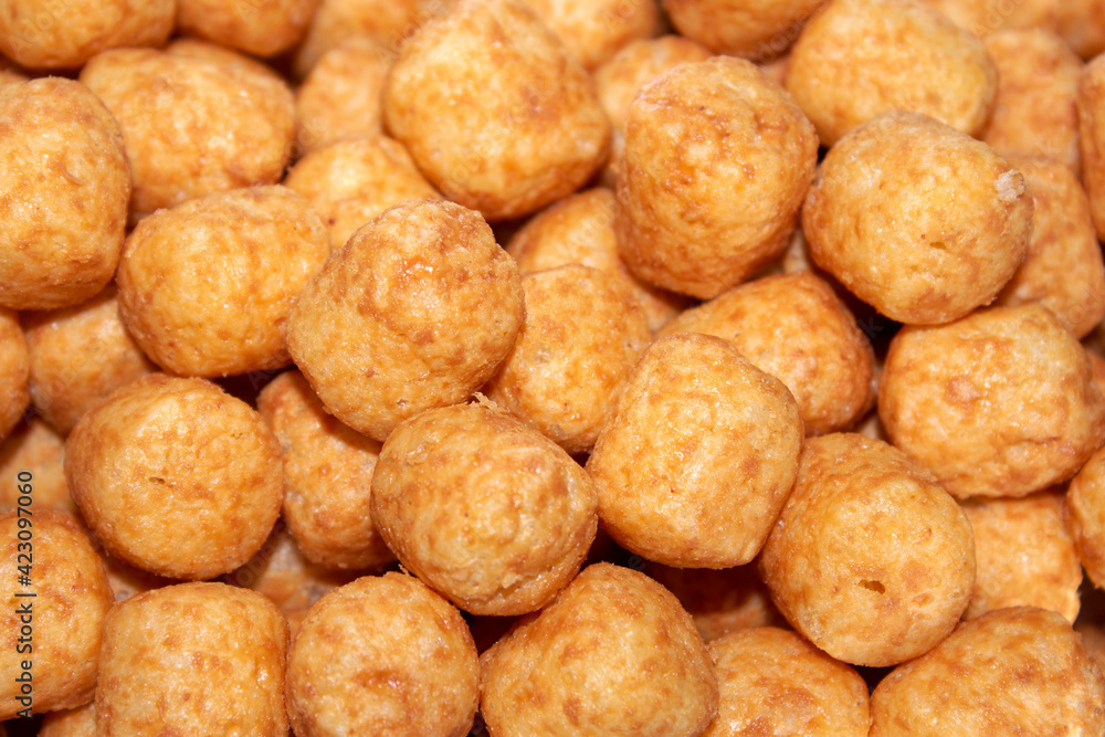 close-up on corn balls with peanut paste. selective focus close-up on corn balls with peanut paste. selective focus