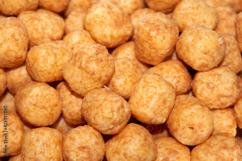 close-up on corn balls with peanut paste. selective focus