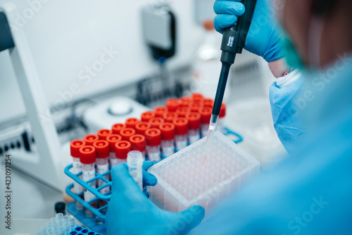 The PCR tester takes a sample analysis from a test tube
