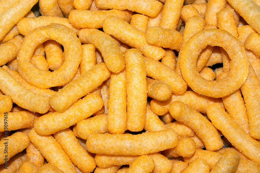 top view of cheese flavored corn snacks top view of cheese flavored corn snacks