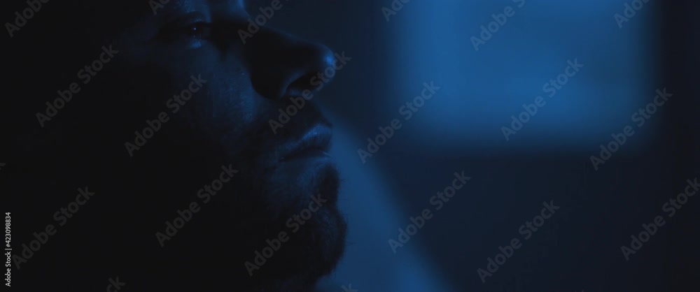 Close up of a soldier sitting alone in a room, dealing with PTSD. Close up of a soldier sitting alone in a room, dealing with PTSD.