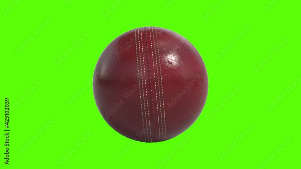 Side on view of a 3D cricket ball slowly rolling on the spot. Shiny red cricket ball in a