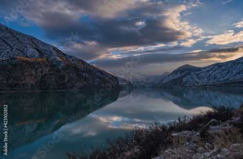 Lake Tortum , Eastern Turkey. Beautiful reflection at the surface of lake Lake Tortum at sunset. Mysterious color and atmosphere. Tortum, Erzurum, Turkey. January 2021