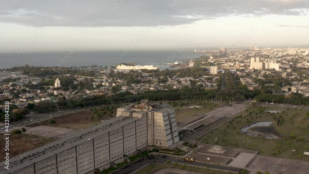 view of santo domingo, drone fly above Lighthouse of Christopher Columbus, cityscape at distance and ocean seascape sea view
