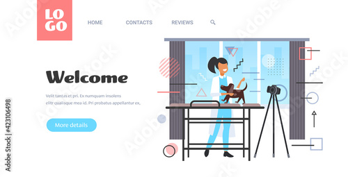 female veterinarian blogger checking dog at veterinarian clinic woman recording online video with camera on tripod blogging concept modern vet clinic template horizontal copy space full length