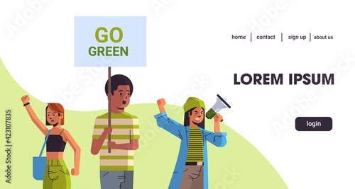 environmental activists holding poster go green save planet strike concept mix race protesters campaigning to protect earth demonstrating against global warming portrait horizontal copy space