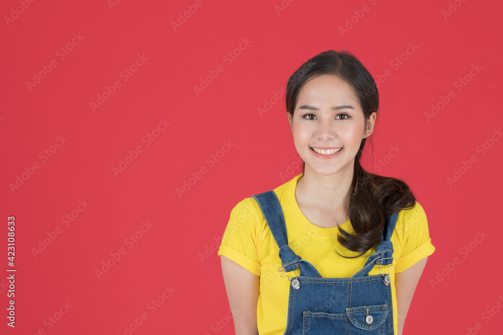 Woman smile and dodges her hand at her back.. Woman smile and dodges her hand at her back..