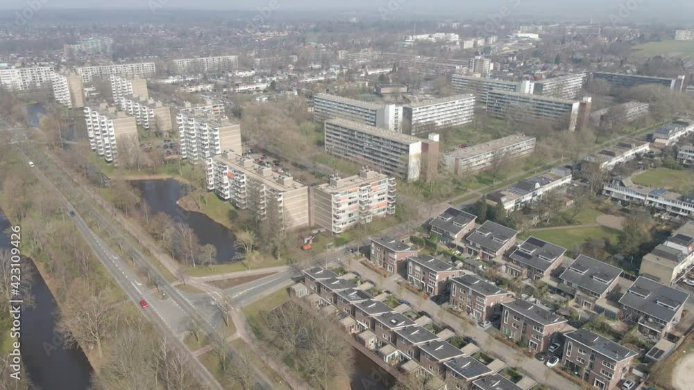 Aerial of apartment buildings at the edge of suburban neighborhood Aerial of apartment buildings at the edge of suburban neighborhood