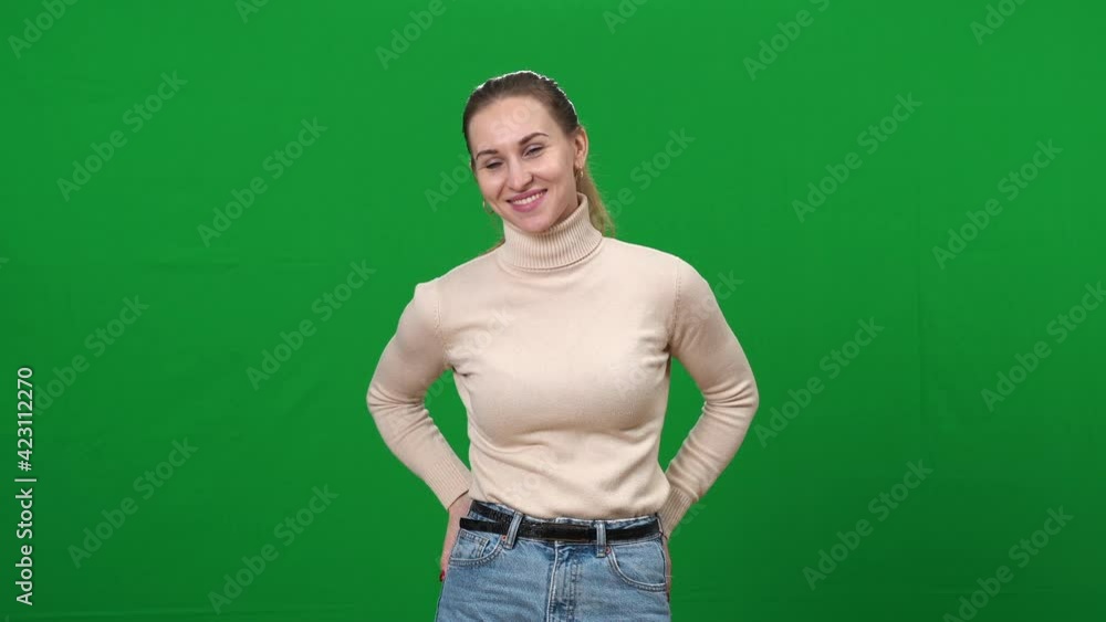 Portrait of anxious woman searching for wallet, finding in pocket and smiling. Worried young Caucasian inattentive lady posing at chromakey green screen background. Portrait of anxious woman searching for wallet, finding in pocket and smiling. Worried young Caucasian inattentive lady posing at chromakey green screen background.