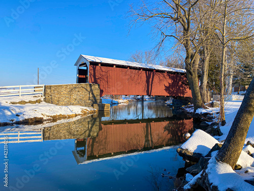 Erb's Mill with reflection in a peaceful stream in Lancaster County, PA photo