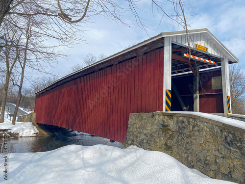 Kauffman's Distillery Covered Bridge on a snowy crisp morning in Lancaster County Pennsylvania photo